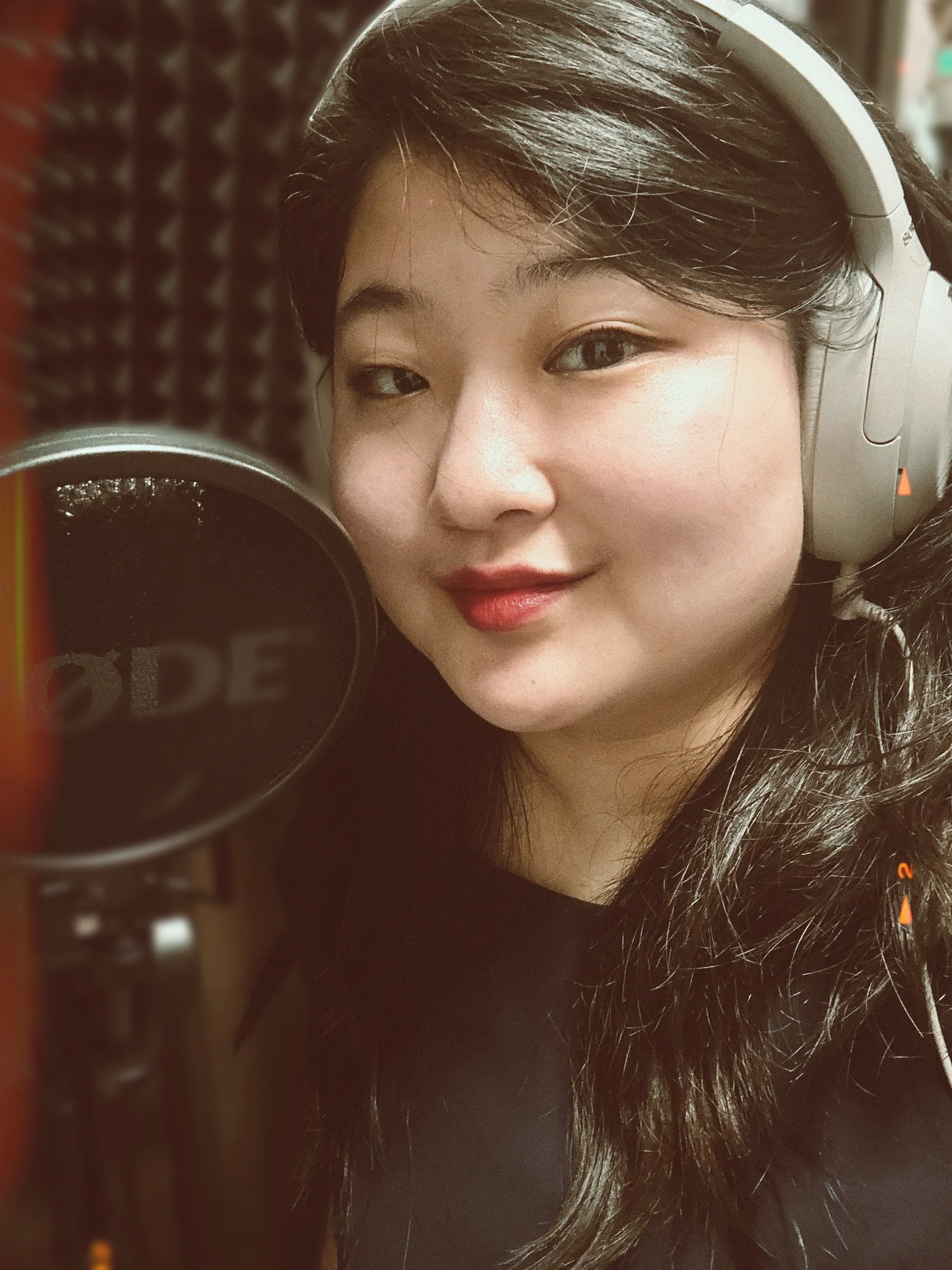 Da Eun Yoon recording at her microphone